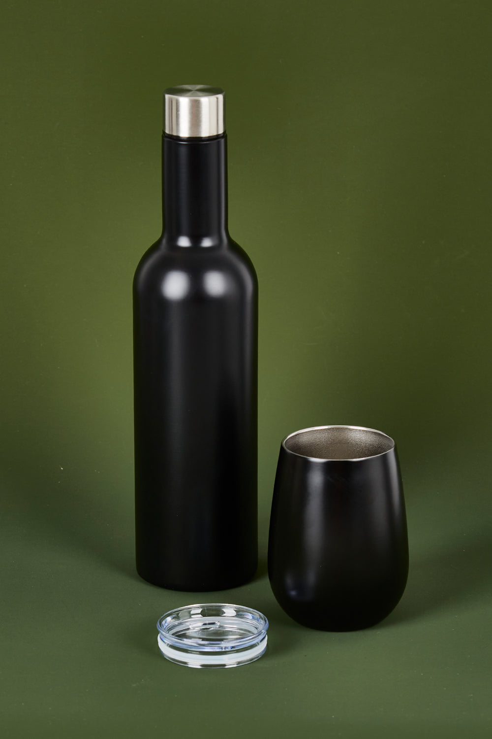 A model wearing the Matte Wine Bottle in colour Black (Black), from the front, showing the whole outfit