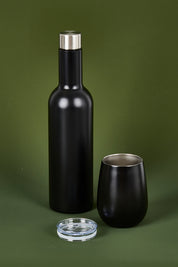 A model wearing the Matte Wine Bottle in colour Black (Black), from the front, showing the whole outfit