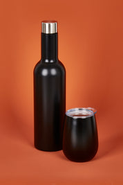 A model wearing the Matte Wine Bottle in colour Black (Black), from the front, showing the whole outfit