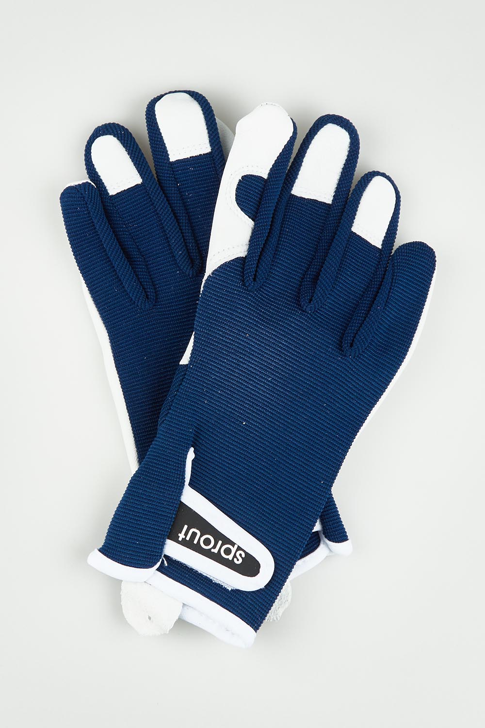 A model wearing the Sprout Goatskin Gloves in colour Navy (Blue), from the front, showing the whole outfit