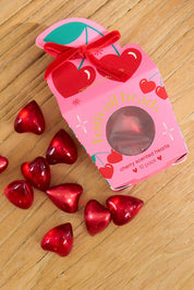 A model wearing the Cherry Bath Oil Beads in colour Pinkred (Pink), from the front, showing the whole outfit