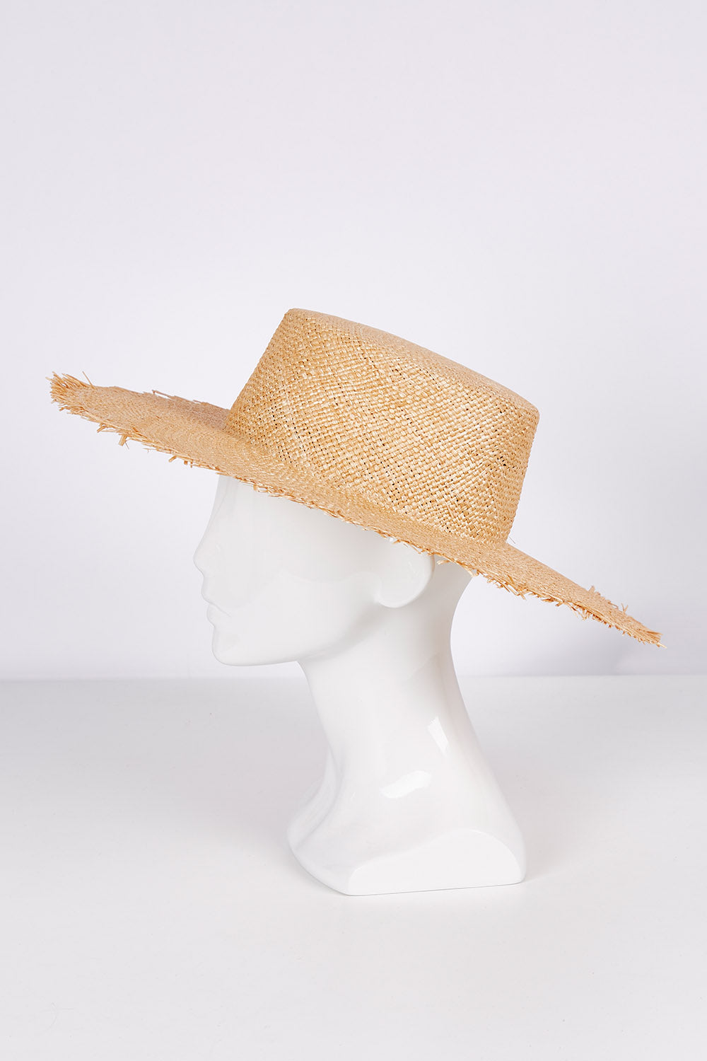 A model wearing size OneSize of the Leonora Bao Straw Sun Hat in colour Natural, from the front, showing the whole outfit