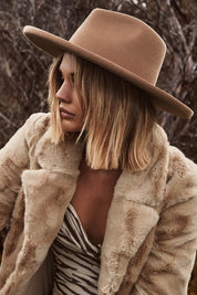 A model wearing the Coolibah Australian Wool Hat in colour Nut, from the front, showing the whole outfit