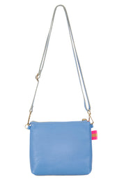 Product shot of the Alexis Leather Crossbody in colour Cornflower (Blue), from the back