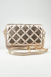 A model wearing the Sarah Leather Quilted Crossbody in colour Gold (Metallics), from the front, showing the whole outfit