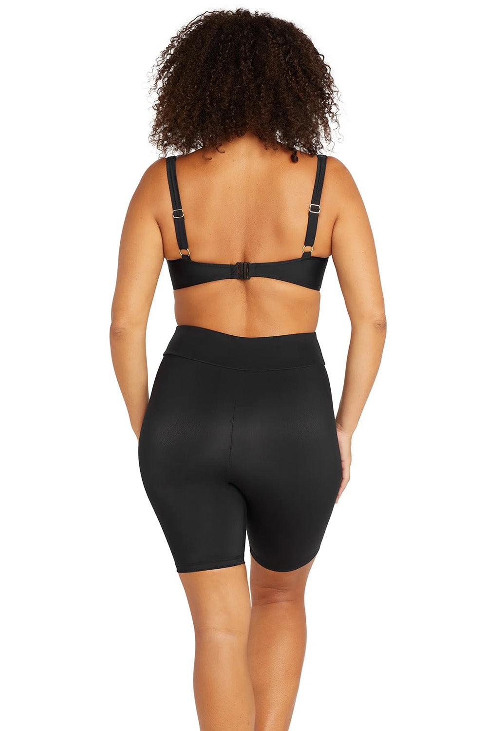 A model wearing the Michelangelo Bike Pant in colour Black (Black), from the back