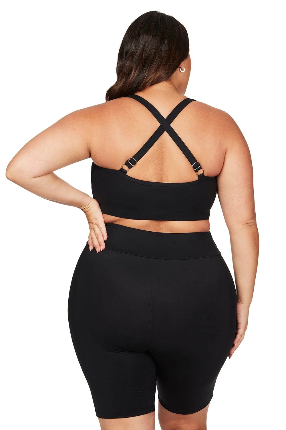 A model wearing the Michelangelo Bike Pant in colour Black (Black), from the back