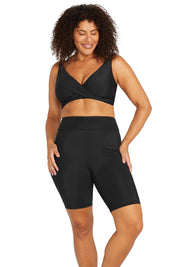 A model wearing the Michelangelo Bike Pant in colour Black (Black), from the front, cropped image