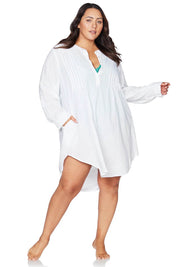 A model wearing the Gershwin Overshirt Cover Up in colour White (White), from the front, showing the whole outfit