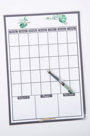 A model wearing size OneSize of the Reusable A3 Monthly Wall Calendar And Pen Set in colour Greenery (Green), from the front, showing the whole outfit