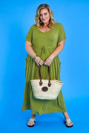 Model Caitlin wearing size 3XL of the Mila Maxi Dress in colour Cardamom (Green), from the front, showing the whole outfit