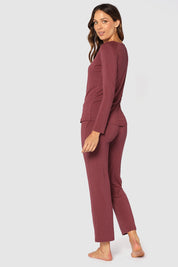 A model wearing the Relax PJ Long Bamboo Pants in colour Burgundy (Red), from the back