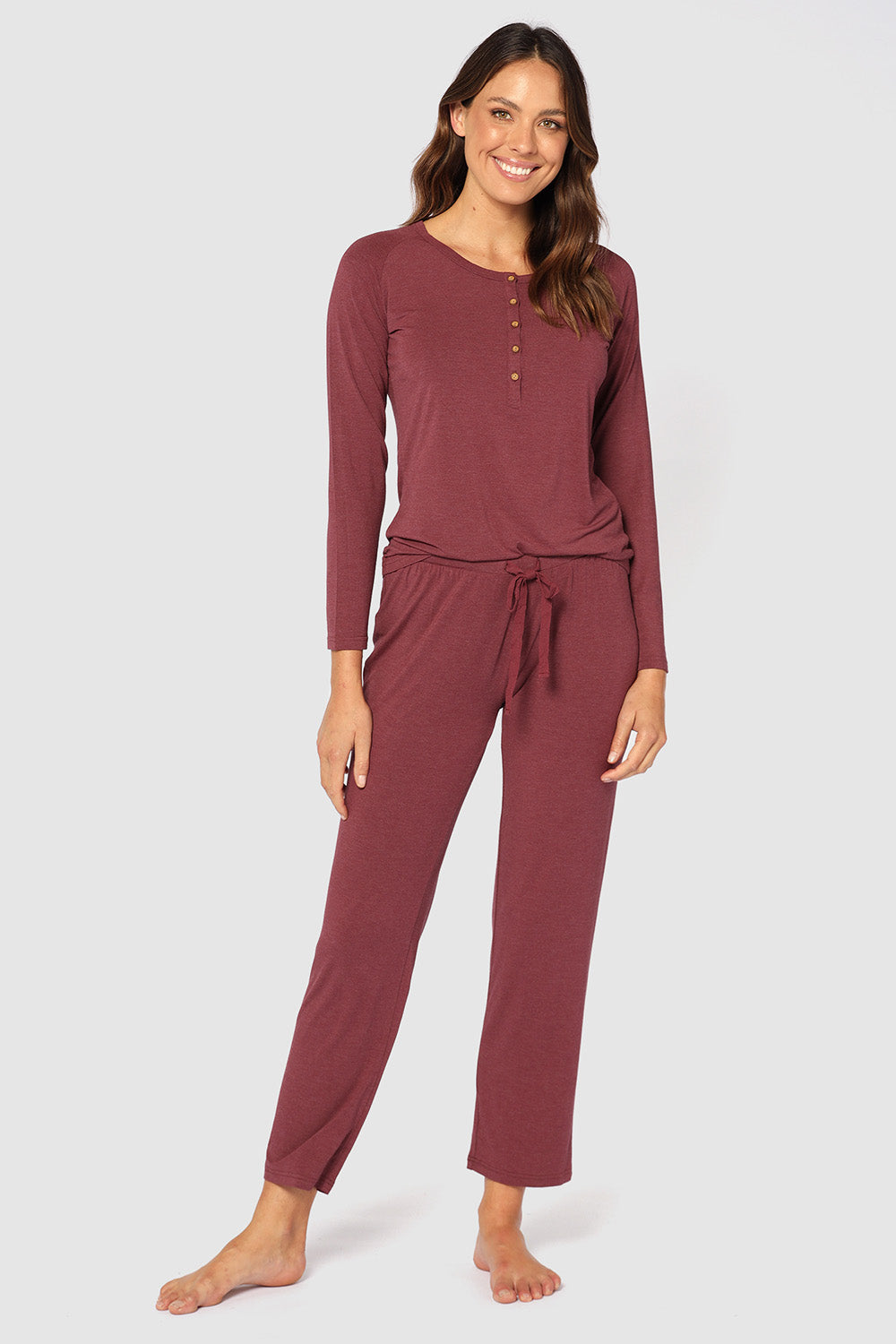 A model wearing the Relax PJ Long Bamboo Pants in colour Burgundy (Red), from the front, showing the whole outfit