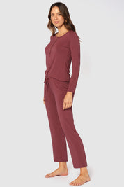 A model wearing the Relax PJ Long Bamboo Pants in colour Burgundy (Red), from the front, showing the whole outfit
