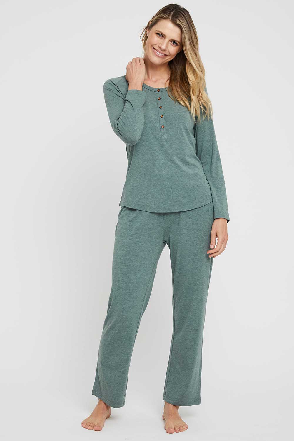 A model wearing the Relax PJ Long Bamboo Pants in colour Moss (Green), from the front, showing the whole outfit