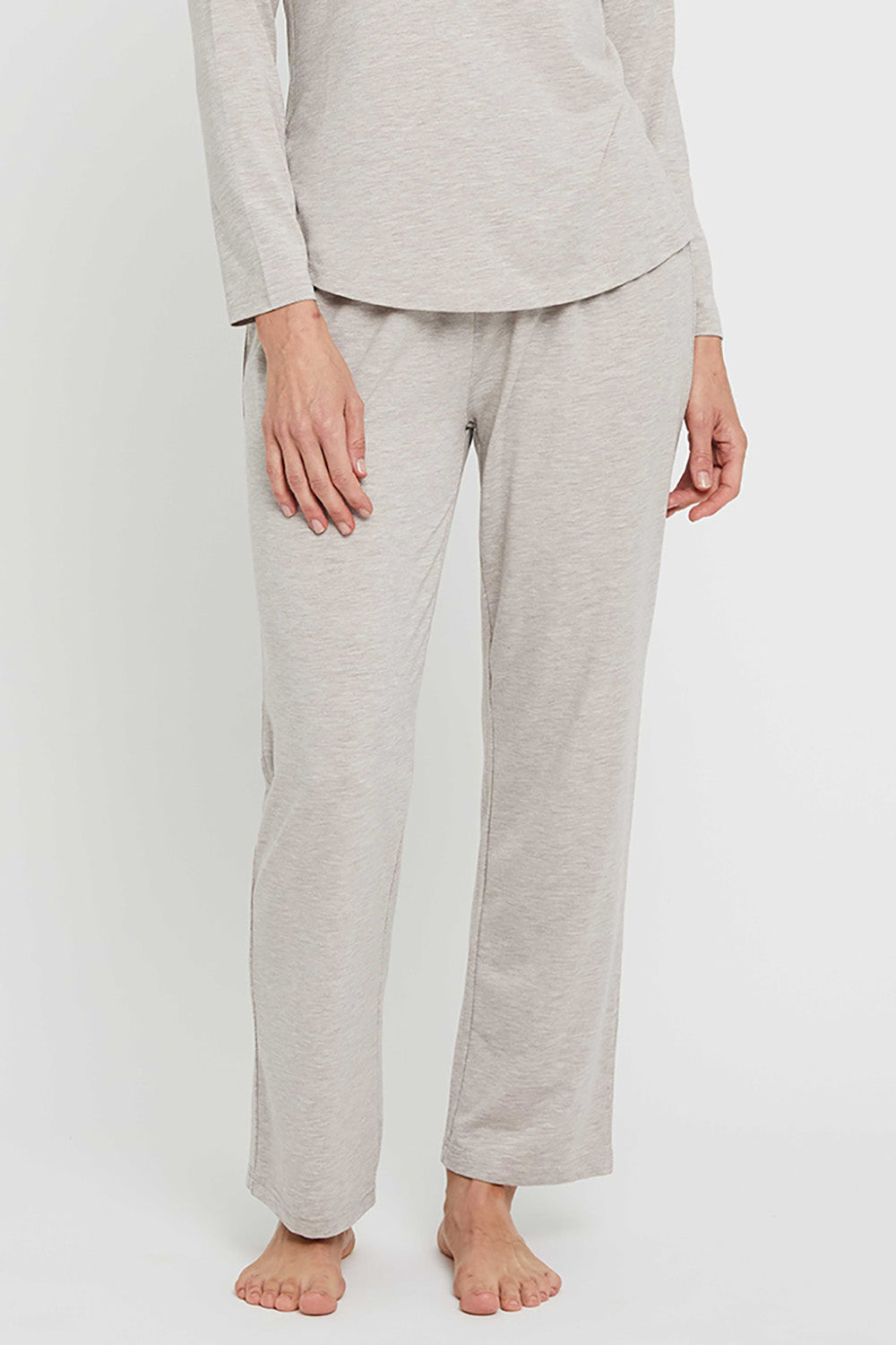 A model wearing the Relax PJ Long Bamboo Pants in colour Oatmeal, from the front, cropped image