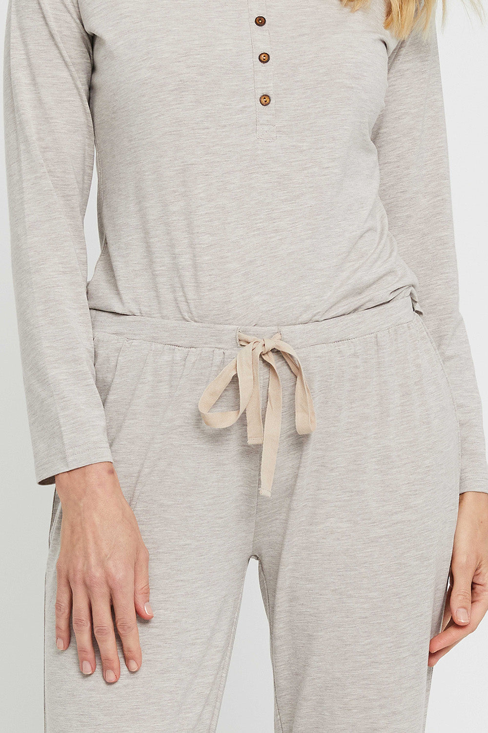 A model wearing the Relax PJ Long Bamboo Pants in colour Oatmeal, from the front, cropped image