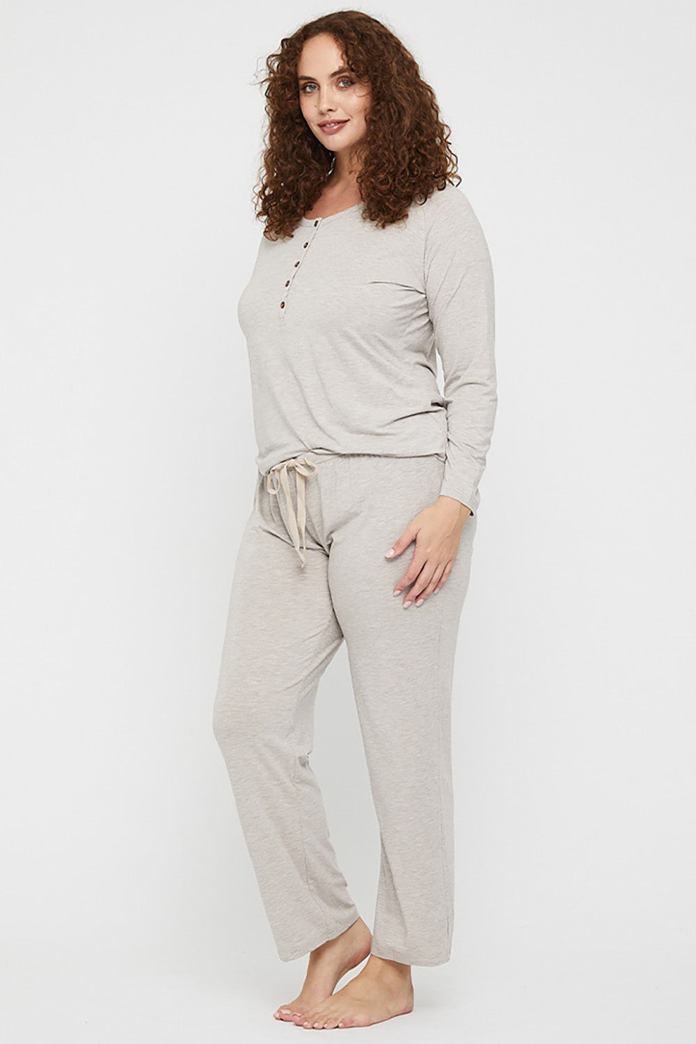 A model wearing the Relax PJ Long Bamboo Pants in colour Oatmeal, from the front, showing the whole outfit