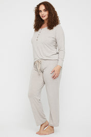 A model wearing the Relax PJ Long Bamboo Pants in colour Oatmeal, from the front, showing the whole outfit