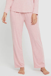 A model wearing the Relax PJ Long Bamboo Pants in colour Rose (Pink), from the front, cropped image