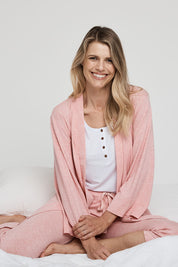 A model wearing the Relax PJ Long Bamboo Pants in colour Rose (Pink), from the front, showing the whole outfit