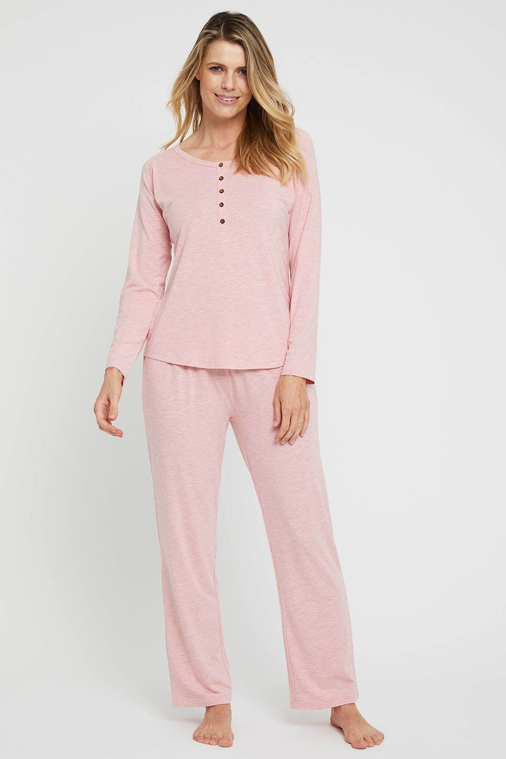 A model wearing the Relax PJ Long Bamboo Pants in colour Rose (Pink), from the front, showing the whole outfit