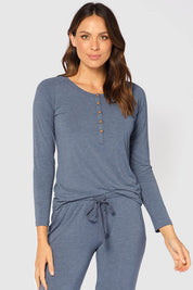 A model wearing the Henley Long Sleeve Bamboo Top in colour Twilight (Blue), from the front, cropped image