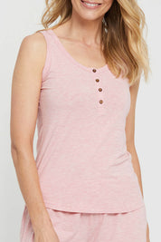A model wearing the Henley Bamboo Singlet in colour Rose (Pink), from the front, cropped image