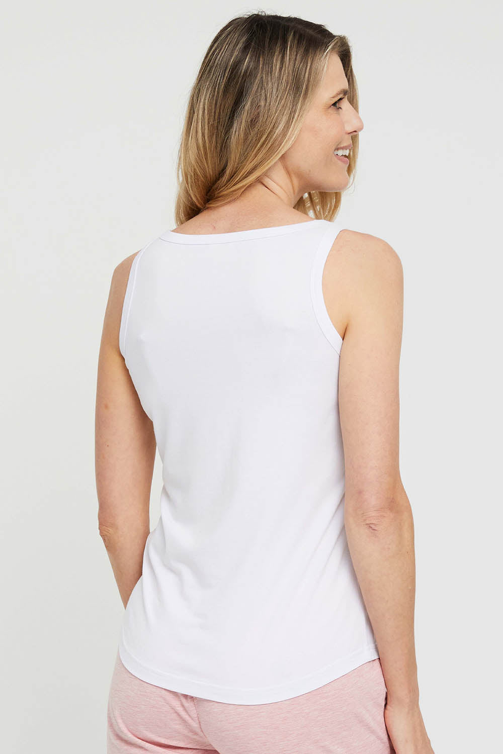 A model wearing the Henley Bamboo Singlet in colour White (White), from the back