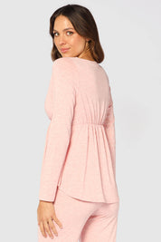 A model wearing the Long Sleeve Cross Front PJ Top in colour Rose (Pink), from the back