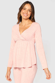 A model wearing the Long Sleeve Cross Front PJ Top in colour Rose (Pink), from the front, cropped image