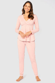 A model wearing the Long Sleeve Cross Front PJ Top in colour Rose (Pink), from the front, showing the whole outfit