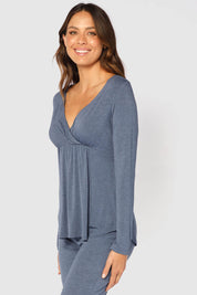 A model wearing the Long Sleeve Cross Front PJ Top in colour Twilight (Blue), from the front, cropped image
