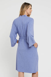 A model wearing the Bamboo Robe in colour Lavender (Blue), from the back