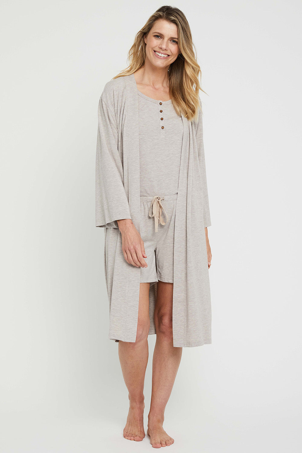 A model wearing the Bamboo Robe in colour Oatmeal, from the front, showing the whole outfit