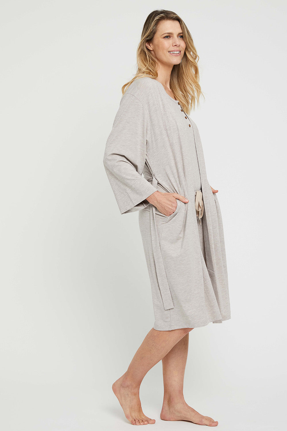 A model wearing the Bamboo Robe in colour Oatmeal, from the front, showing the whole outfit