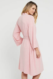 A model wearing the Bamboo Robe in colour Rose (Pink), from the back