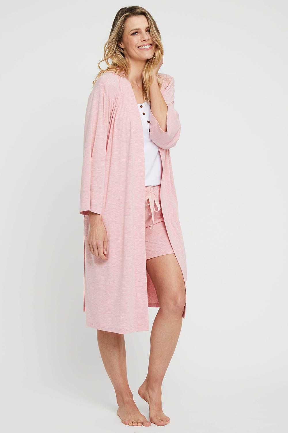 A model wearing the Bamboo Robe in colour Rose (Pink), from the front, showing the whole outfit