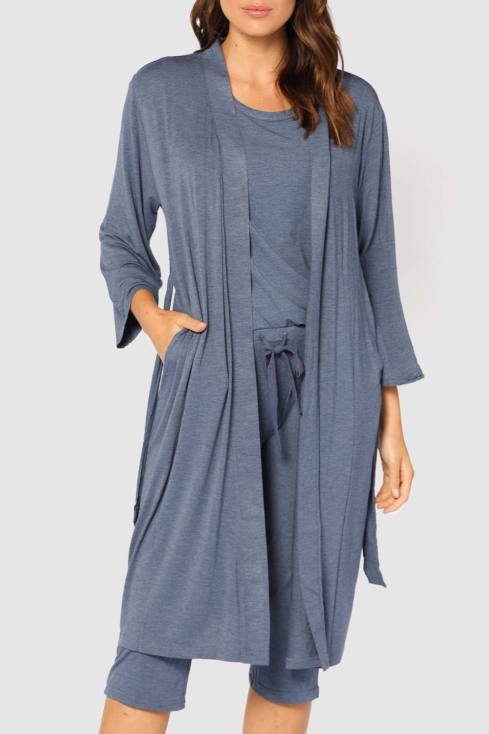A model wearing the Bamboo Robe in colour Twilight (Blue), from the front, cropped image