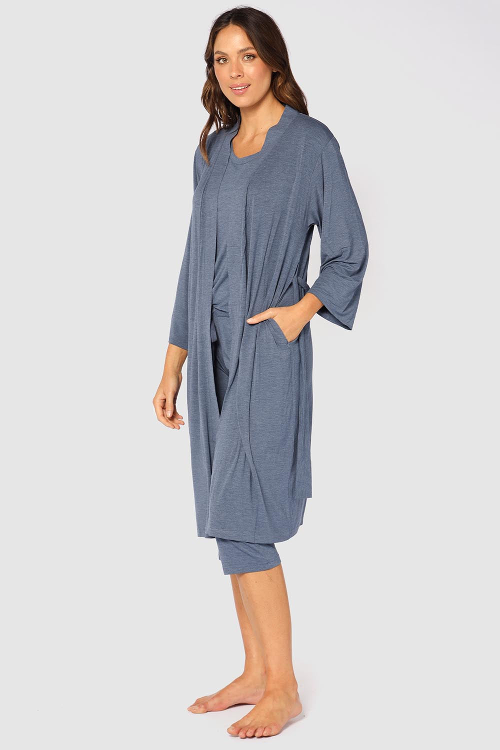 A model wearing the Bamboo Robe in colour Twilight (Blue), from the front, showing the whole outfit