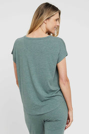 A model wearing the Lounge Bamboo Tee in colour Moss (Green), from the back