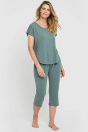 A model wearing the Lounge Bamboo Tee in colour Moss (Green), from the front, showing the whole outfit