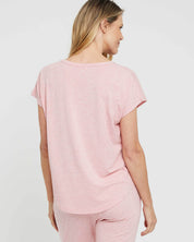 A model wearing the Lounge Bamboo Tee in colour Rose (Pink), from the back