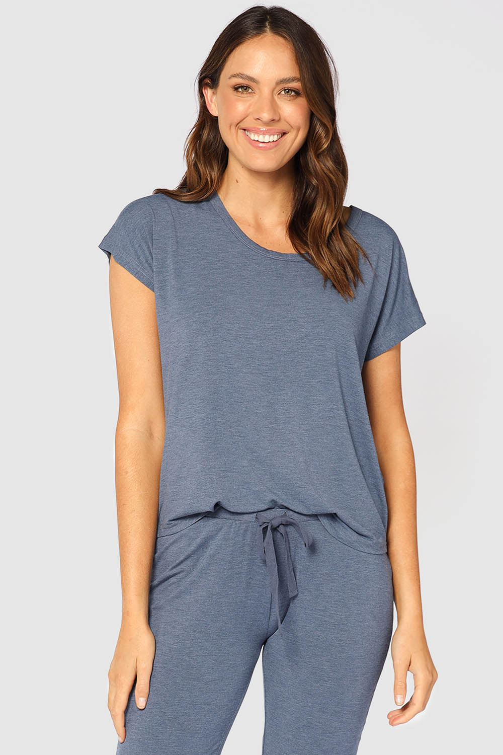 A model wearing the Lounge Bamboo Tee in colour Twilight (Blue), from the front, cropped image