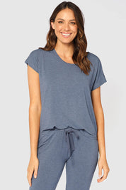 A model wearing the Lounge Bamboo Tee in colour Twilight (Blue), from the front, cropped image