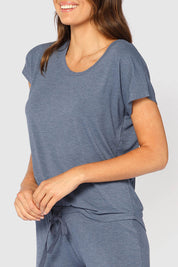 A model wearing the Lounge Bamboo Tee in colour Twilight (Blue), from the front, cropped image