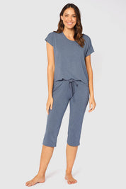 A model wearing the Lounge Bamboo Tee in colour Twilight (Blue), from the front, showing the whole outfit