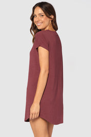 A model wearing the Bamboo Nightie in colour Burgundy (Red), from the back