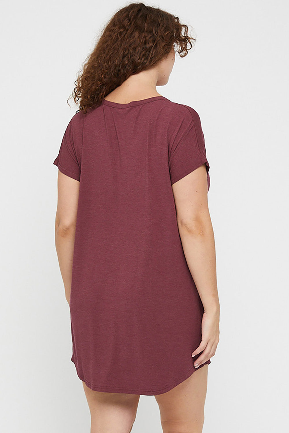 A model wearing the Bamboo Nightie in colour Burgundy (Red), from the back