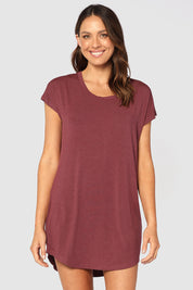 A model wearing the Bamboo Nightie in colour Burgundy (Red), from the front, cropped image